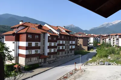 a view of a town with mountains in the background at New Inn in Bansko
