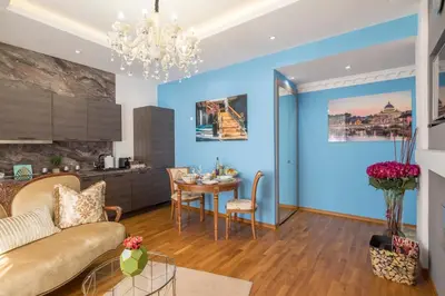 a living room with a couch and a table at Parliament Sofia - Top Center Luxury Apartment in Sofia