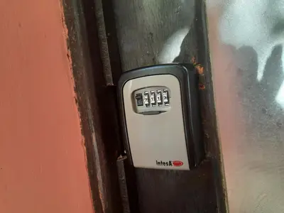 a black and white door with a lock on it at Studio Cathlyn in Sofia