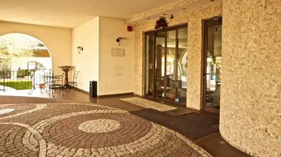 a room with a brick wall and a tile floor at Boutique Hotel L do Rado in Sofia