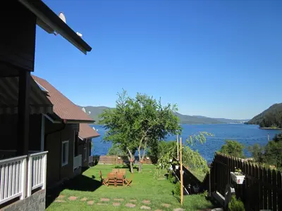 a house with a view of a body of water at Holiday Village Orlino in Sarnitsa