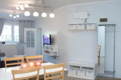 a kitchen and dining room with a table and chairs at Cozy Apartment in the very centre of Sofia in Sofia