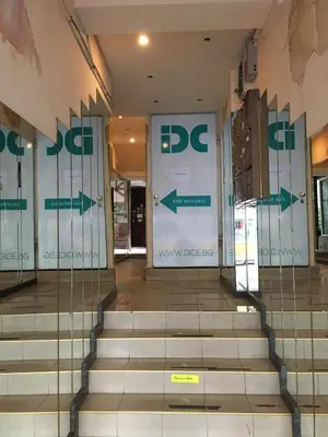 a lobby of a building with doors and stairs at Cozy Apartment in the very centre of Sofia in Sofia