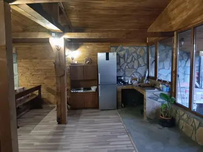 a kitchen with a white refrigerator in a room at Къща Момина сълза in Sapareva Banya