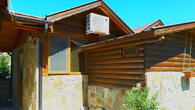 a house with an air conditioner on the roof at Къща Момина сълза in Sapareva Banya