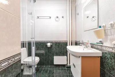 a bathroom with a toilet and a sink and a shower at Eleganto - Central 2BD Stylish Apartment by Flat Mаnager in Sofia