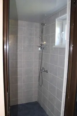 a bathroom with a shower with a glass door at Apartment Raya in Sapareva Banya