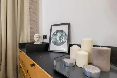 a desk with candles and a picture on it at R34 Boutique Hotel in Sofia