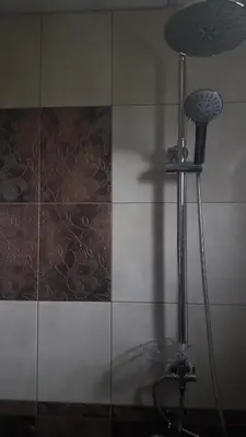 a shower in a bathroom with a shower head at Guest Rooms IDeR in Sapareva Banya