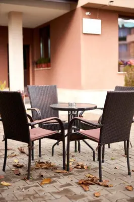 a group of chairs and a table and a table and chairs at Flamingo Plovdiv in Plovdiv