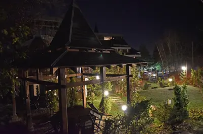 a gazebo in a park at night at Vila 6aTo Hotel & Wellnes in Sofia