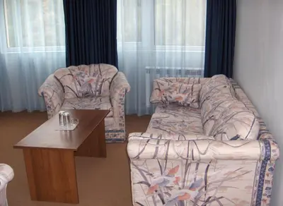 a living room with a couch and a coffee table at Комплекс Белвю - Банкя in Bankya