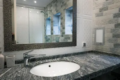 a bathroom with a sink and a mirror at Shahbazian House in Plovdiv