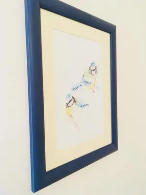 a framed painting of two skiers on skis at Urban Garden in Sofia