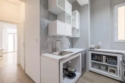 a kitchen with white cabinets and a sink at blueWaveplace - Stylish 2 BR Home in Center of Sofia in Sofia
