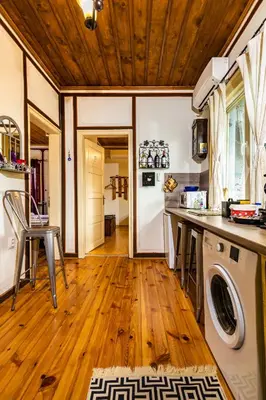 a kitchen with a washer and dryer at Blacksmith's House - Old Town in Plovdiv