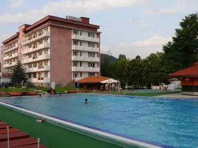 a large swimming pool in front of a hotel at Почивна станция Витоша in Velingrad