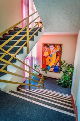 a staircase with a painting on the wall at Art Hotel Simona in Sofia