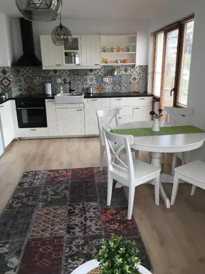 a kitchen with a table and chairs in a kitchen at Willy Villy's Home- Chepelare in Chepelare
