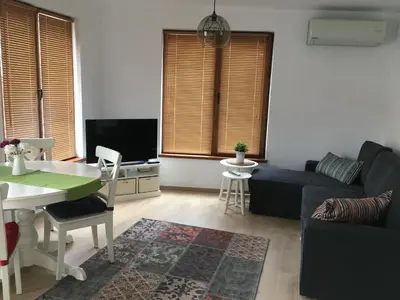 a living room with a couch and a table at Willy Villy's Home- Chepelare in Chepelare