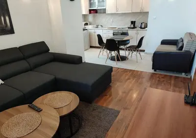 a living room with a couch and a table at Family 2 bed Apartment in Bansko in Bansko