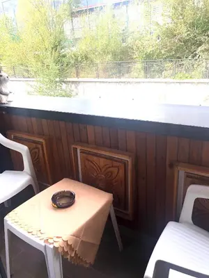 a table with a bowl on it next to a window at Стаи за гости Топ Старс Смолян in Smolyan