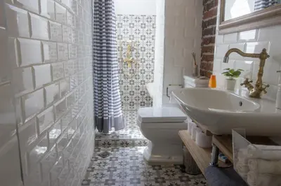 a bathroom with a sink and a toilet and a shower at Good Stay Sofia Apartments in Sofia