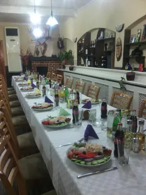 a long table with plates of food and drinks at Complex Diana in Cherven