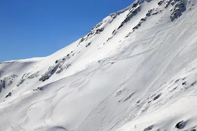 a mountain covered in snow on a clear day at Nice and quiet apartment next to Gondola lift. in Bansko