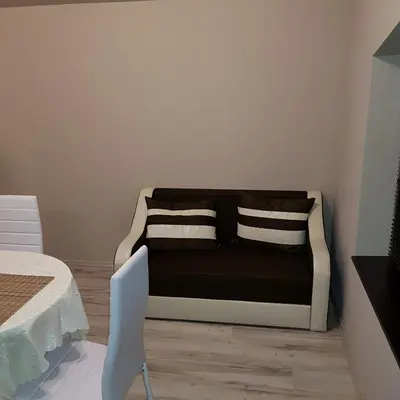 a room with a couch with two pillows on it at Guest House Ileana in Sapareva Banya