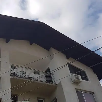 a building with a balcony on the side of it at Guest House Ileana in Sapareva Banya