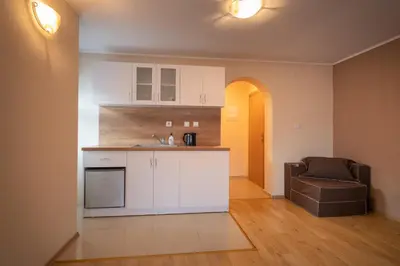 a kitchen with a sink and a chair in a room at Sky Garden House in Velingrad