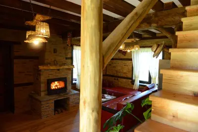a living room with a couch and a fireplace at Dream house in Leshten