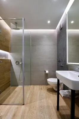 a bathroom with a shower and a toilet and a sink at Adella Boutique Hotel - Free Secured Parking in Sofia