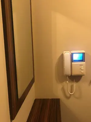 a phone is on the wall in a bathroom at Rakovski Apartment GN / FREE GARAGE in Sofia