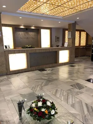 a hotel lobby with a bouquet of flowers on the floor at Park Hotel Ribaritsa in Ribarica