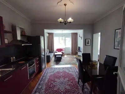 a living room with a kitchen and a dining room at Top Center Apartment 7 in Sofia