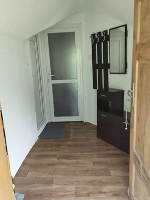 an empty room with a door and a mirror at Tolem in Borino