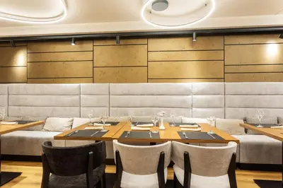 a dining room with a table and chairs at Kamengrad Hotel & SPA in Panagyurishte