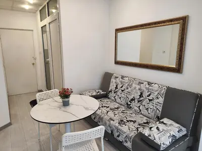a living room with a couch and a table at Стаи за гости Ве-Бо-Ли** in Bankya