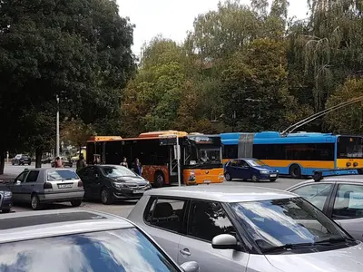 a group of buses and cars on a city street at blue room in Sofia