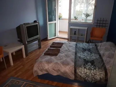 a bedroom with a bed and a tv in it at blue room in Sofia