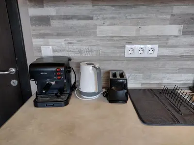 a coffee maker and a toaster on a counter at All Seasons Apartments Iglika 2 in Borovets