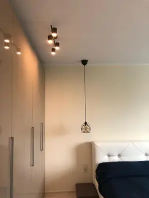 a bedroom with a bed and a ceiling at Apartment 
