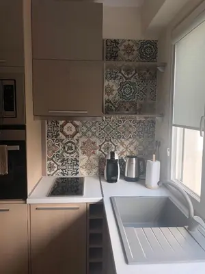 a small kitchen with a sink and a stove at Apartment 