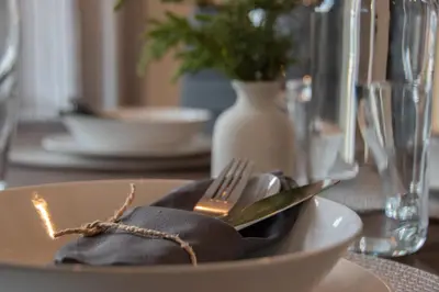 a plate with a fork and a napkin on a table at Hyggemate - 2 Bed Room Warm Stay in Sarnitsa in Sarnitsa