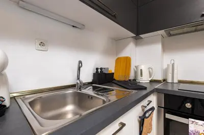 a kitchen with a sink and a counter top at Apartment Valerie walking distance to Top Center in Plovdiv
