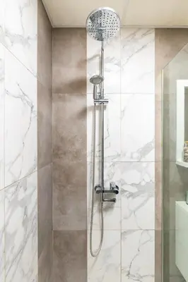 a bathroom with a shower with a glass door at Apartment Valerie walking distance to Top Center in Plovdiv