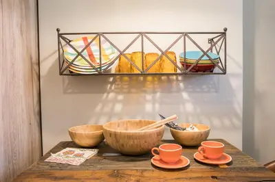 a wooden table with bowls and cups on it at Este Apart - Top center in Sofia