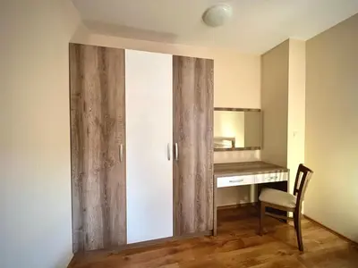 a room with a sliding door with a desk at RELAX aпартаменти, Смолянски езера, вила ВЕНЕРА, к-с Маунтин Лейк in Smolyan